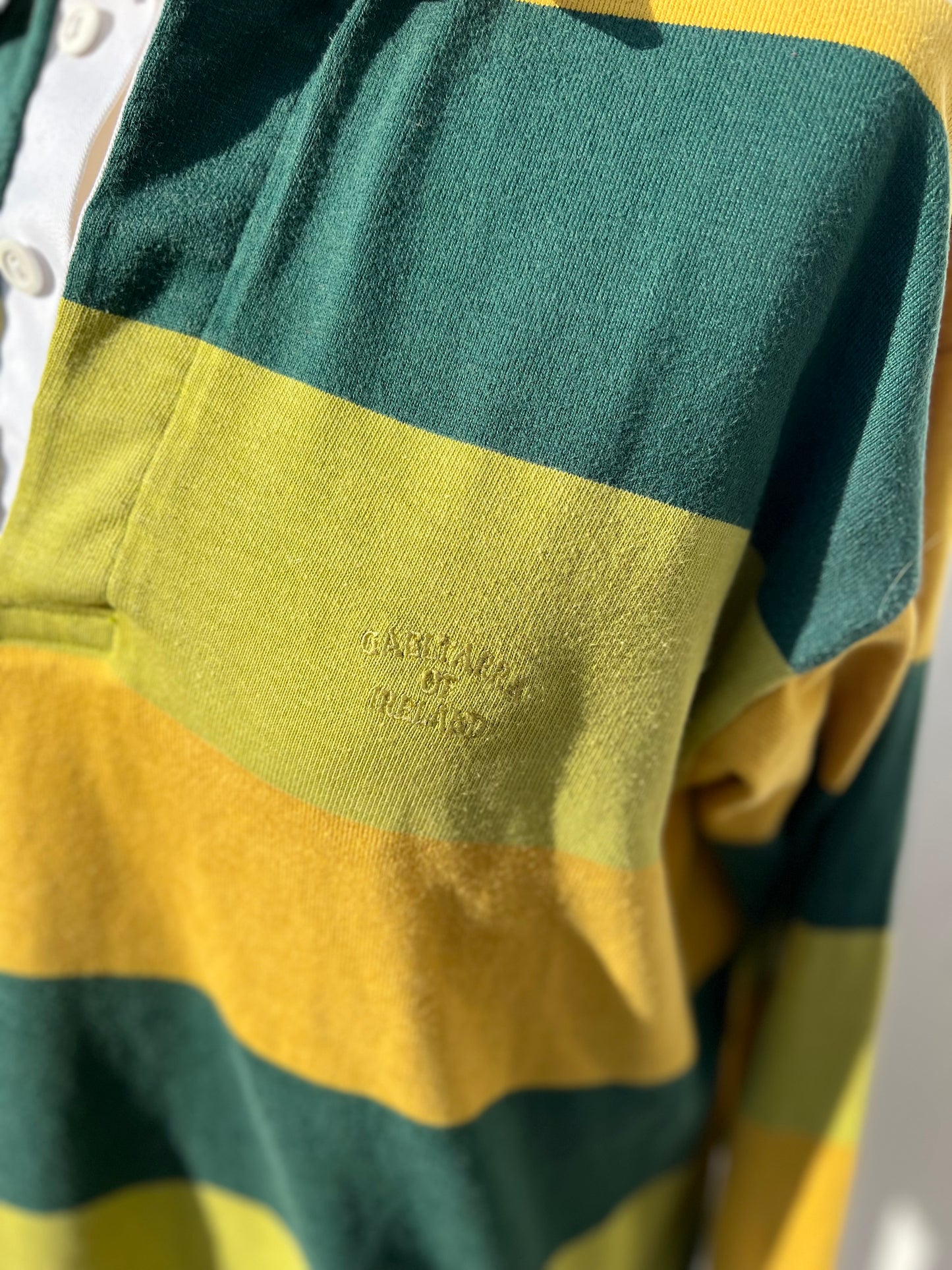 Yellow, green and chartreuse striped rugby shirt