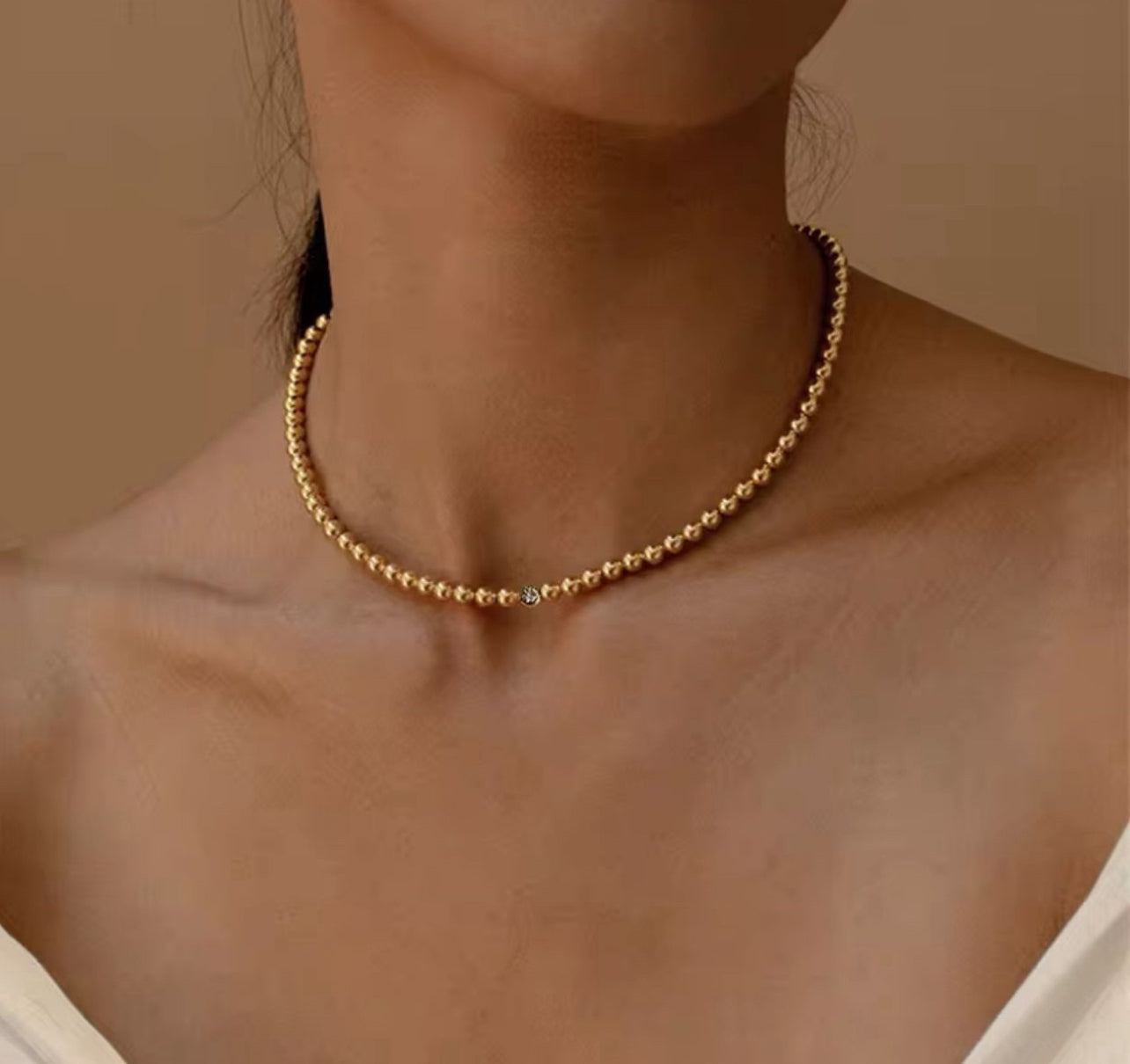 Jessie; gold plated bead necklace