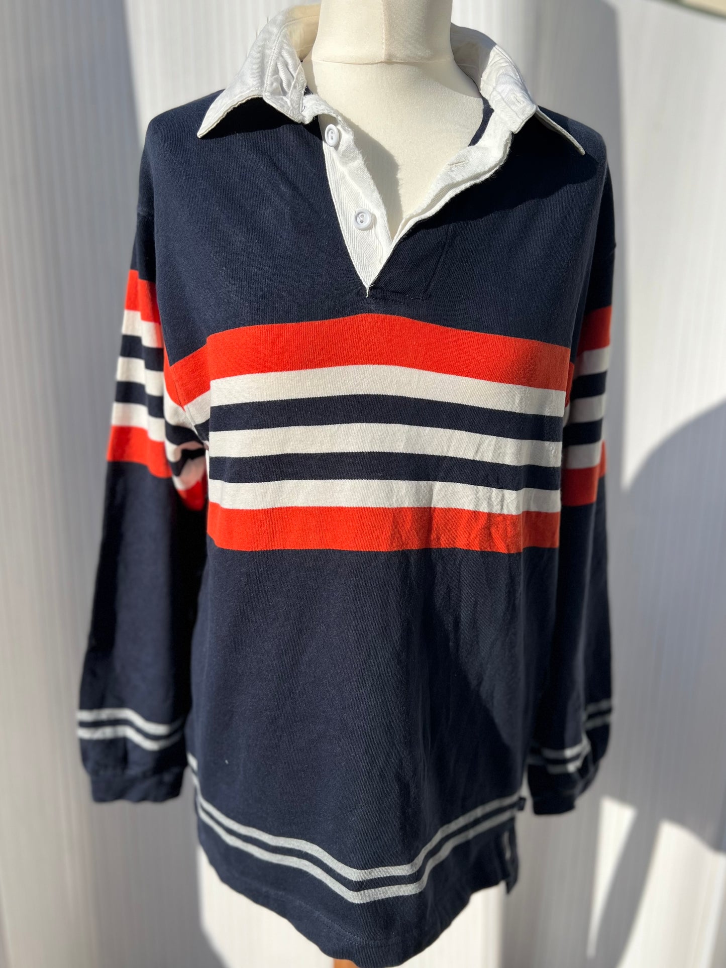 Navy, orange and white striped rugby shirt