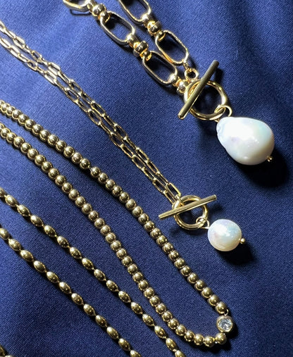 Celeste chunky gold plated thread through necklace with large baroque pearl pendant