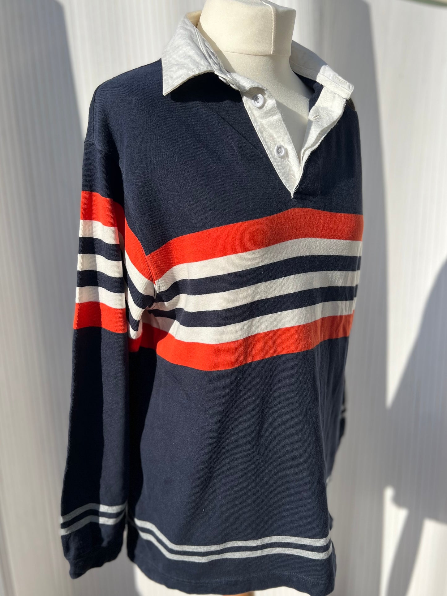 Navy, orange and white striped rugby shirt